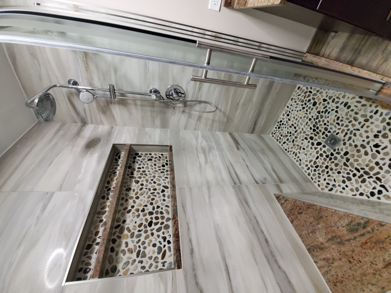 Complete bathroom gut renovation with heated floors by Alpha Development Group