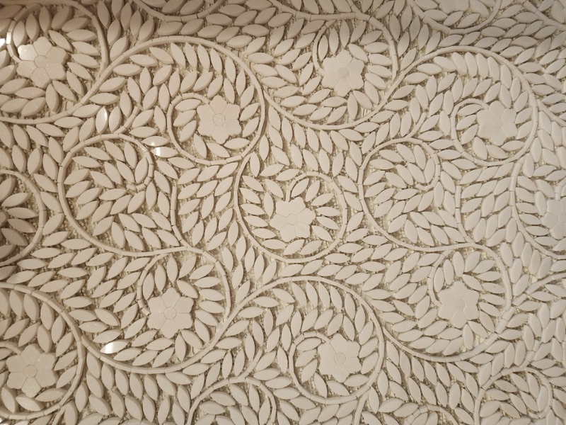 Intricate handcrafted tile detail by Alpha Development Group — precision craftsmanship